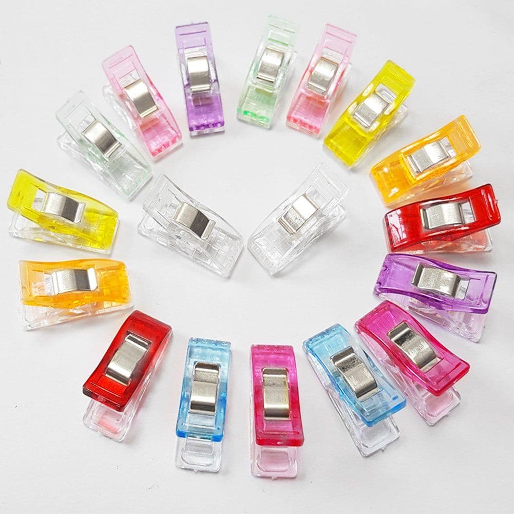 Colorful plastic sewing clips holding fabric layers together — ONSA sewing blog